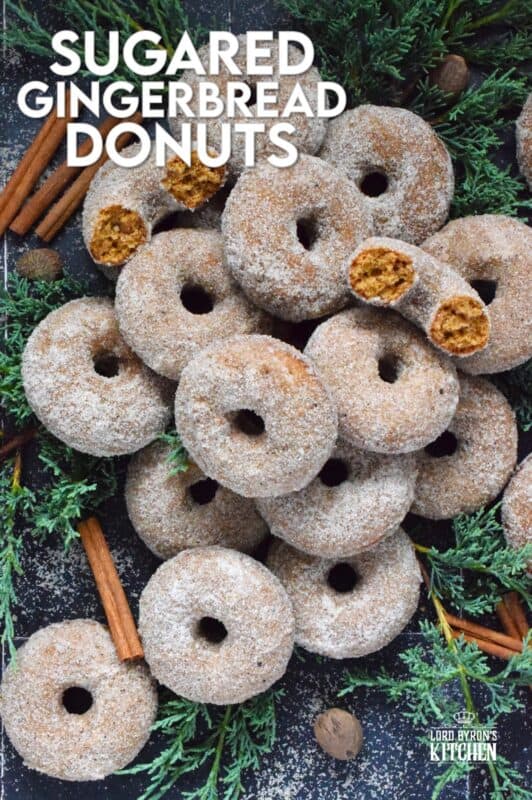 Prepared with everyone's favourite seasoning spices, like cinnamon, nutmeg, ginger, cloves, and allspice, these Sugared Gingerbread Donuts are baked and rolled in sugar while still warm out of the oven. Indulgent, sweet, rich, and delicious, these donuts taste like Christmas! #gingerbread #donuts #bakednotfried