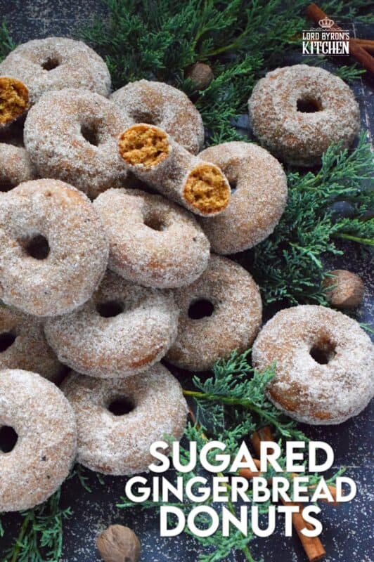 Prepared with everyone's favourite seasoning spices, like cinnamon, nutmeg, ginger, cloves, and allspice, these Sugared Gingerbread Donuts are baked and rolled in sugar while still warm out of the oven. Indulgent, sweet, rich, and delicious, these donuts taste like Christmas! #gingerbread #donuts #bakednotfried