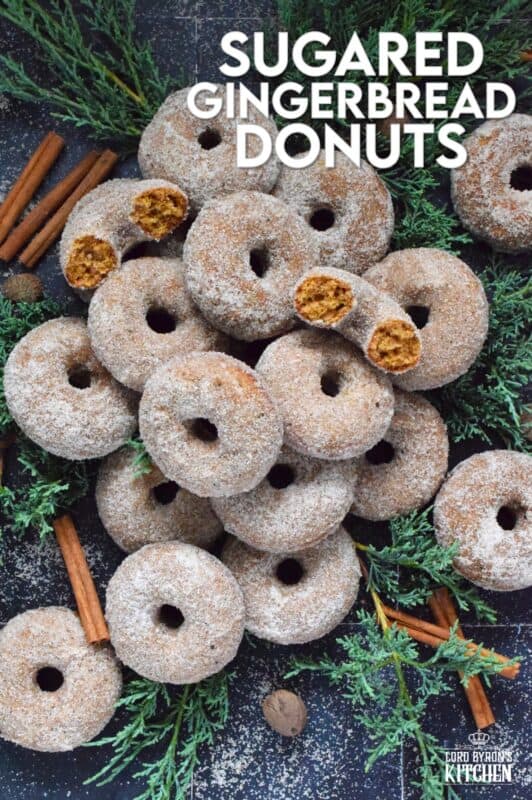 Prepared with everyone's favourite seasoning spices, like cinnamon, nutmeg, ginger, cloves, and allspice, these Sugared Gingerbread Donuts are baked and rolled in sugar while still warm out of the oven. Indulgent, sweet, rich, and delicious, these donuts taste like Christmas! #gingerbread #donuts #bakednotfried