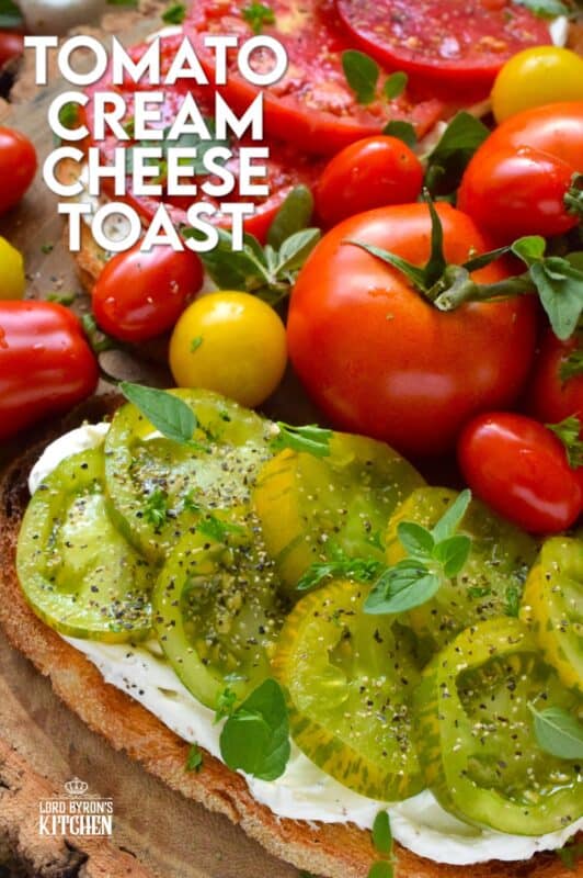 Summer fresh tomatoes are piled onto lightly toasted bread with a generous spread made with cream cheese. Tomato Cream Cheese Toast is a delicious summertime lunch or an appetizer too! Don't forget to season the tomatoes well and use fresh herbs for flavour and garnish. #sandwich #tomato #openfaced #creamcheese