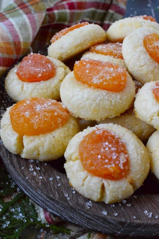 Sugary Dried Apricot Cookies are prepared with a mild and lightly sweetened cookie dough so that the flavour of the dried apricot is at the forefront. Sprinkled with a glistening sugary topping, these simple cookies are so flavourful and quite pretty too! The texture of the apricot and the soft crumble of the cookie is a perfect pairing. #apricot #dried #christmas #cookies