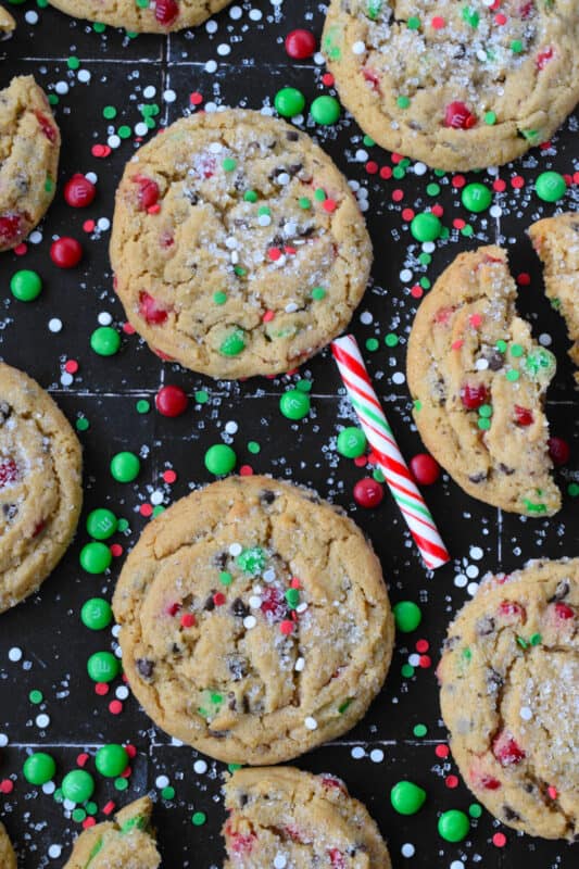 If you can't indulge a little at Christmas time, then there is just no point! These soft and chewy, chocolatey Holiday M&M Peanut Butter Cookies are certainly indulgent! Not only are they one of the best cookies ever, but they are massive as well! Brighten up your cookie platter with these colourfully festive treats! #M&M #cookies #peanutbutter #chewy #soft #christmas #holiday