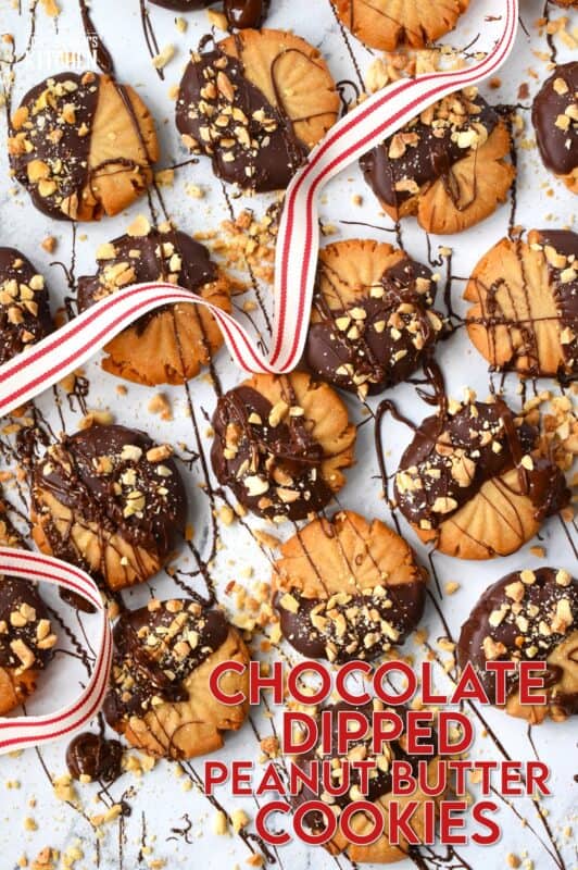 In our home, you cannot go wrong with the classic combination of peanut butter and chocolate! These delicious Chocolate Dipped Peanut Butter Cookies are dipped in melted chocolate and topped with a sprinkling of chopped salted peanuts. These are so easy to make, so whip up several batches and gift them to your friends, neighbours, and coworkers! #peanutbutter #cookies #chocolate #christmas #holiday #baking
