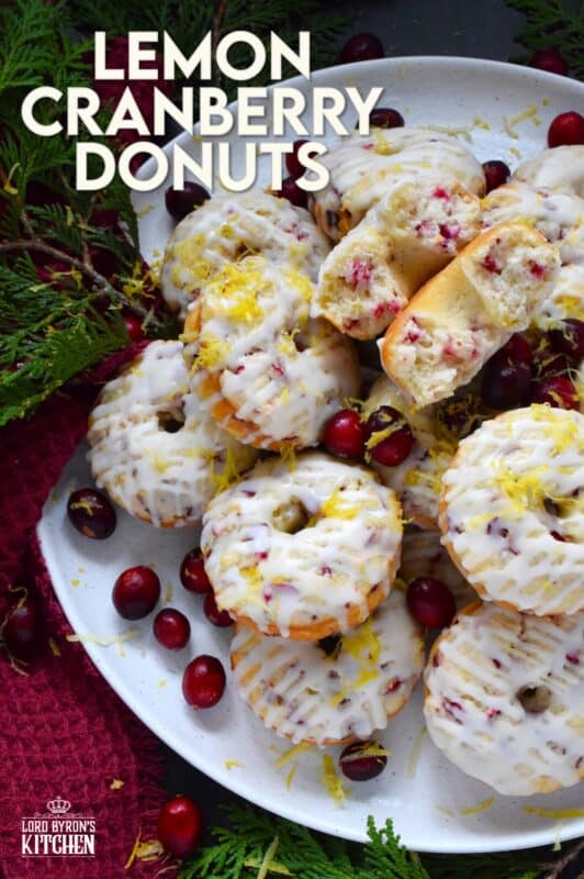 The tartness of lemon and cranberries is well balanced with sugary sweetness in these delightfully refreshing Lemon Cranberry Donuts! Prepared with freshly squeezed lemon juice and lemon zest, chopped cranberries, and a lemony glaze, these donuts are simply irresistible! #lemon #cranberry #donuts