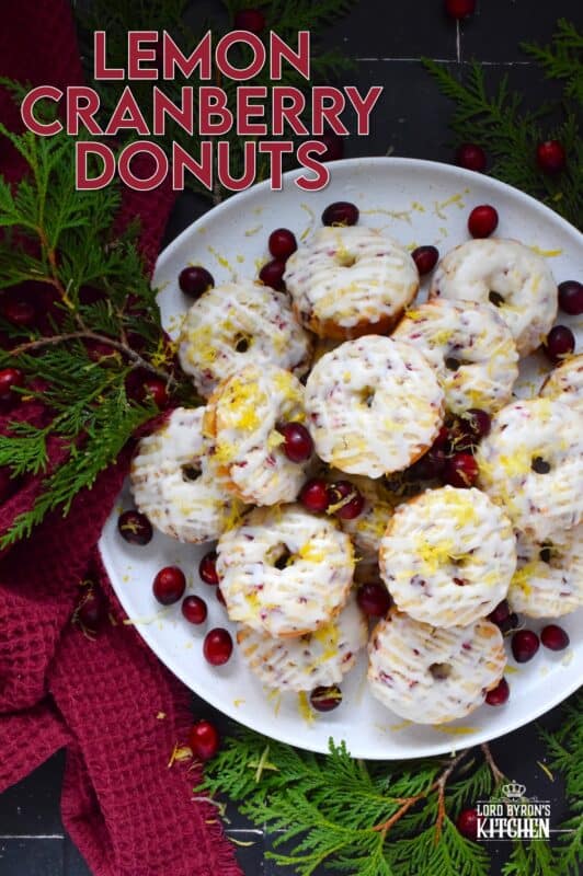 The tartness of lemon and cranberries is well balanced with sugary sweetness in these delightfully refreshing Lemon Cranberry Donuts! Prepared with freshly squeezed lemon juice and lemon zest, chopped cranberries, and a lemony glaze, these donuts are simply irresistible! #lemon #cranberry #donuts