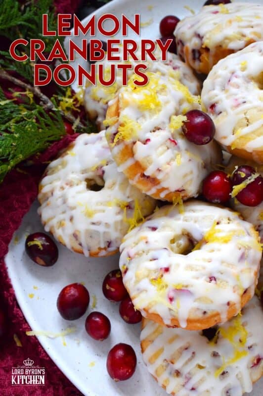 The tartness of lemon and cranberries is well balanced with sugary sweetness in these delightfully refreshing Lemon Cranberry Donuts! Prepared with freshly squeezed lemon juice and lemon zest, chopped cranberries, and a lemony glaze, these donuts are simply irresistible! #lemon #cranberry #donuts