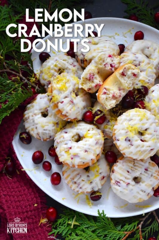 The tartness of lemon and cranberries is well balanced with sugary sweetness in these delightfully refreshing Lemon Cranberry Donuts! Prepared with freshly squeezed lemon juice and lemon zest, chopped cranberries, and a lemony glaze, these donuts are simply irresistible! #lemon #cranberry #donuts