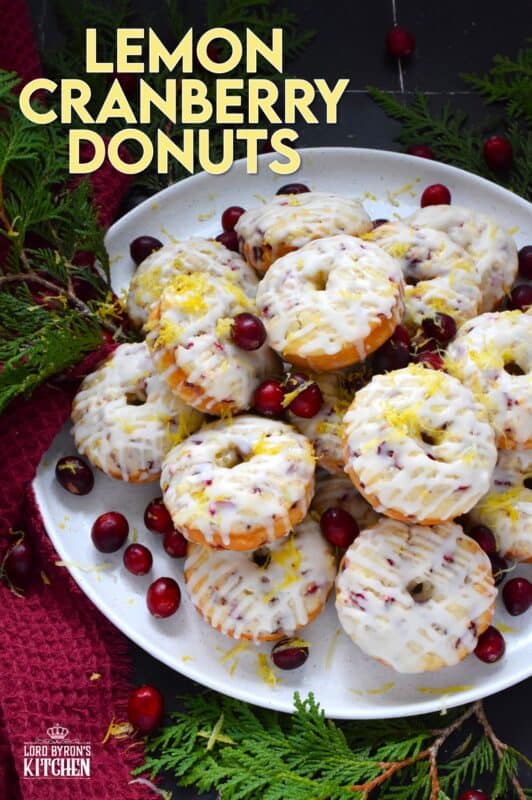 The tartness of lemon and cranberries is well balanced with sugary sweetness in these delightfully refreshing Lemon Cranberry Donuts! Prepared with freshly squeezed lemon juice and lemon zest, chopped cranberries, and a lemony glaze, these donuts are simply irresistible! #lemon #cranberry #donuts