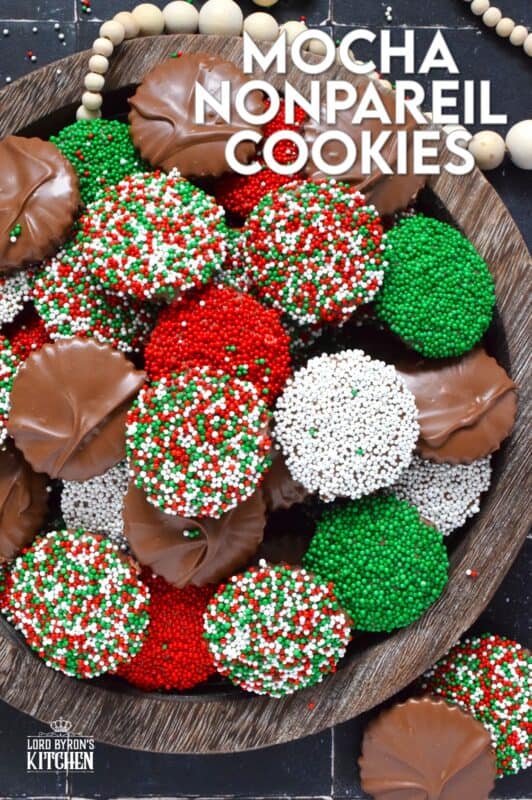Prepared with good baking cocoa, these Mocha Nonpareil Cookies are dipped in melted milk chocolate and covered with everyone's favourite sprinkles! The cookies are firm and crisp, but they melt in your mouth. Baked with a splash of coffee extract, everyone will be trying to guess why these cookies taste so good! #nonpareil #sprinkles #cookies #christmas #chocoalte #dipped