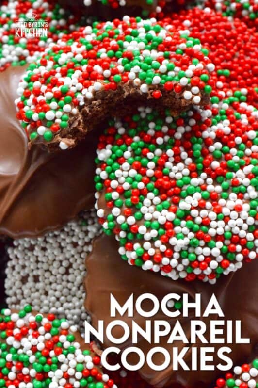 Prepared with good baking cocoa, these Mocha Nonpareil Cookies are dipped in melted milk chocolate and covered with everyone's favourite sprinkles! The cookies are firm and crisp, but they melt in your mouth. Baked with a splash of coffee extract, everyone will be trying to guess why these cookies taste so good! #nonpareil #sprinkles #cookies #christmas #chocoalte #dipped