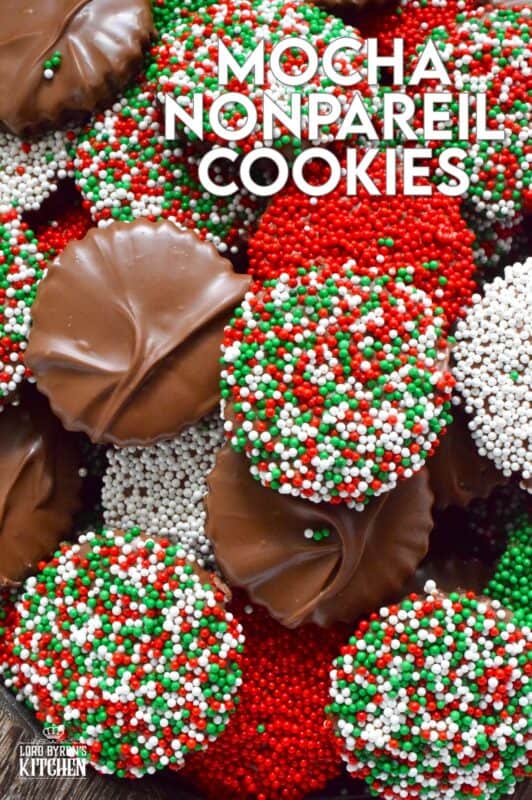 Prepared with good baking cocoa, these Mocha Nonpareil Cookies are dipped in melted milk chocolate and covered with everyone's favourite sprinkles! The cookies are firm and crisp, but they melt in your mouth. Baked with a splash of coffee extract, everyone will be trying to guess why these cookies taste so good! #nonpareil #sprinkles #cookies #christmas #chocoalte #dipped