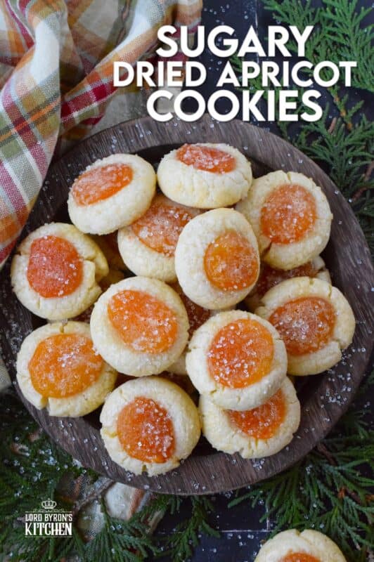 Sugary Dried Apricot Cookies are prepared with a mild and lightly sweetened cookie dough so that the flavour of the dried apricot is at the forefront. Sprinkled with a glistening sugary topping, these simple cookies are so flavourful and quite pretty too! The texture of the apricot and the soft crumble of the cookie is a perfect pairing. #apricot #dried #christmas #cookies