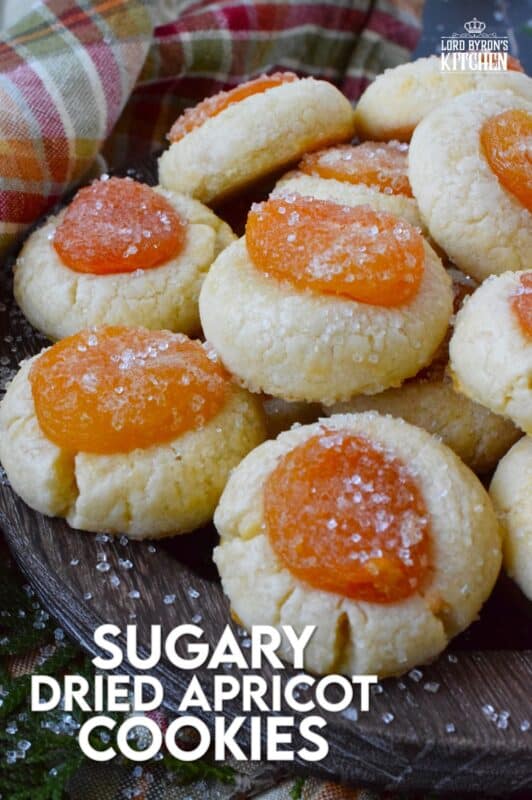 Sugary Dried Apricot Cookies are prepared with a mild and lightly sweetened cookie dough so that the flavour of the dried apricot is at the forefront. Sprinkled with a glistening sugary topping, these simple cookies are so flavourful and quite pretty too! The texture of the apricot and the soft crumble of the cookie is a perfect pairing. #apricot #dried #christmas #cookies