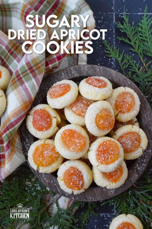 Sugary Dried Apricot Cookies are prepared with a mild and lightly sweetened cookie dough so that the flavour of the dried apricot is at the forefront. Sprinkled with a glistening sugary topping, these simple cookies are so flavourful and quite pretty too! The texture of the apricot and the soft crumble of the cookie is a perfect pairing. #apricot #dried #christmas #cookies