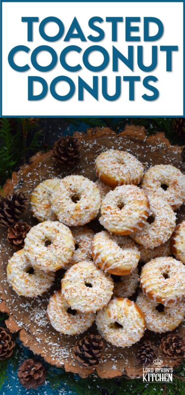 In our home, Christmas would not be Christmas without a confection prepared with coconut and these Toasted Coconut Donuts hit the mark! These are baked and not fried so they are super light! Imagine an old-fashioned glazed donut but with the addition of nutty, crispy toasted coconut - yum! #toasted #coconut #donuts