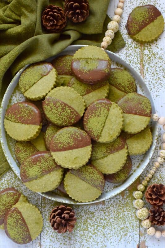 A classic, old-fashioned sweet shortbread recipe is infused with the slightly bitter flavour of matcha. Dipped in melted chocolate, these Matcha Shortbread Cookies boast a delicious pairing all in a beautifully simple festive cookie. These could be a great new addition to your annual cookie exchange! #matcha #whitechocolate #dipped #cookie