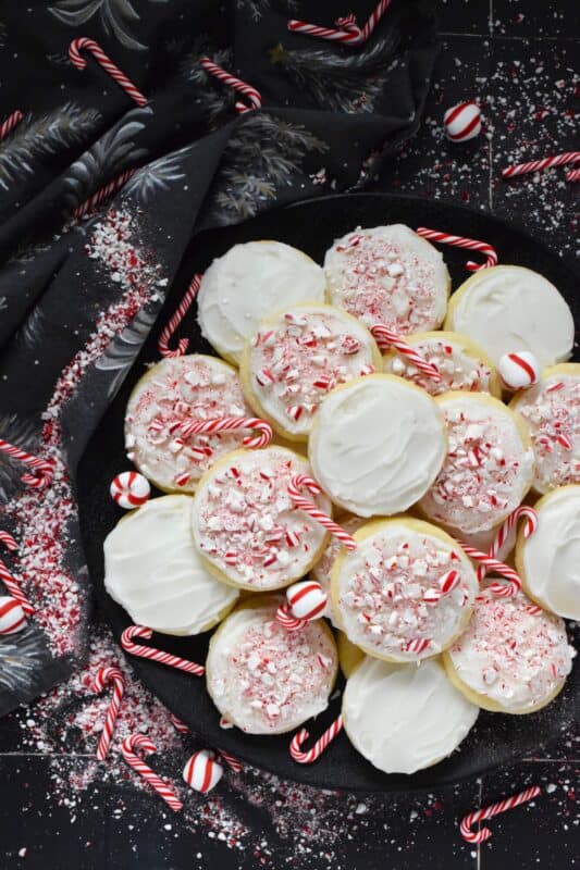 If you love peppermint, these cookies have all the peppermint you could possibly need! Frosted Peppermint Cookies have a buttercream peppermint frosting and lots of crushed candy canes on top. These cookies are soft and moist and melt in your mouth! #christmas #cookies #buttercream #candycanes #peppermint