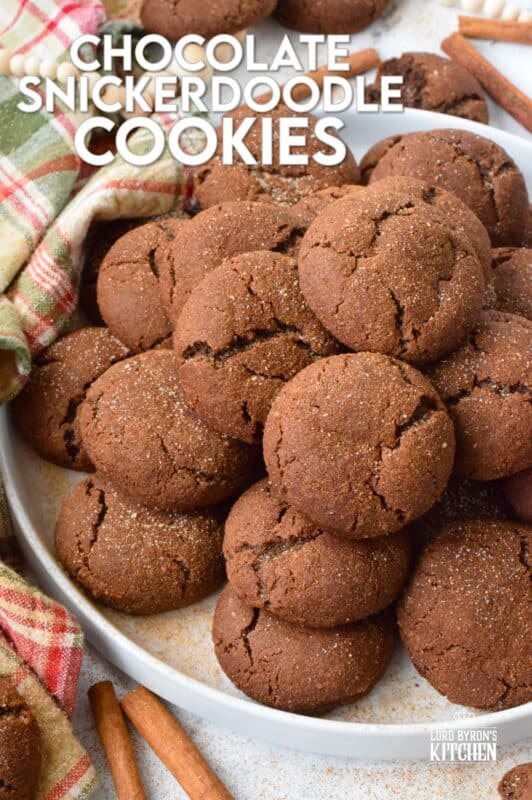 Everyone loves the original snickerdoodle cookie, but this chocolate version is even more delicious!  Prepared with brown sugar and cocoa, the cookies are rolled in a cinnamon sugar mixture, which gives the cookie that recognizable and familiar crinkly appearance.  Chocolate Snickerdoodle Cookies are soft and chewy with slightly crispy outer edges. #snickerdoodles #christmas #cookies #cinnamon