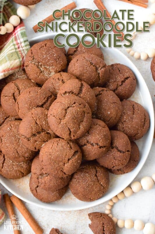 Everyone loves the original snickerdoodle cookie, but this chocolate version is even more delicious!  Prepared with brown sugar and cocoa, the cookies are rolled in a cinnamon sugar mixture, which gives the cookie that recognizable and familiar crinkly appearance.  Chocolate Snickerdoodle Cookies are soft and chewy with slightly crispy outer edges. #snickerdoodles #christmas #cookies #cinnamon