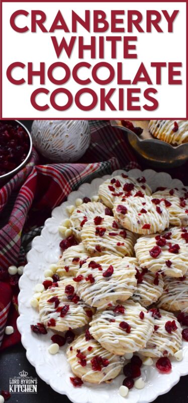 Cranberry White Chocolate Cookies are a simplified version of the seasonally popular bliss bar at Starbucks. Prepared with a light sugar cookie base which is packed with dried cranberries and white chocolate chips, these cookies are topped with a drizzle of white chocolate and even more dried cranberries. #cranberry #chocolate #cookies
