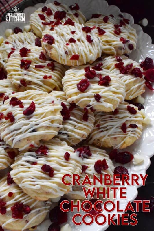 Cranberry White Chocolate Cookies are a simplified version of the seasonally popular bliss bar at Starbucks. Prepared with a light sugar cookie base which is packed with dried cranberries and white chocolate chips, these cookies are topped with a drizzle of white chocolate and even more dried cranberries. #cranberry #chocolate #cookies