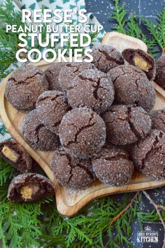 These cookies were prepared with the ultimate chocolate and peanut butter lover in mind. Reese's Peanut Butter Cup Stuffed Cookies are prepared with a rich chocolaty and fudgy base, which is wrapped around a single miniature peanut butter cup candy. These are perfect for Christmastime when calories don't count! #reeses #peanutbuttercups #stuffed #cookies