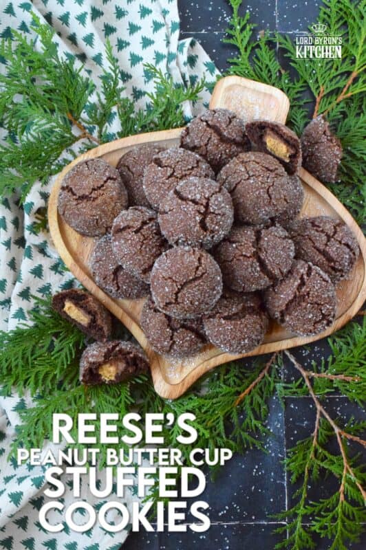 These cookies were prepared with the ultimate chocolate and peanut butter lover in mind. Reese's Peanut Butter Cup Stuffed Cookies are prepared with a rich chocolaty and fudgy base, which is wrapped around a single miniature peanut butter cup candy. These are perfect for Christmastime when calories don't count! #reeses #peanutbuttercups #stuffed #cookies