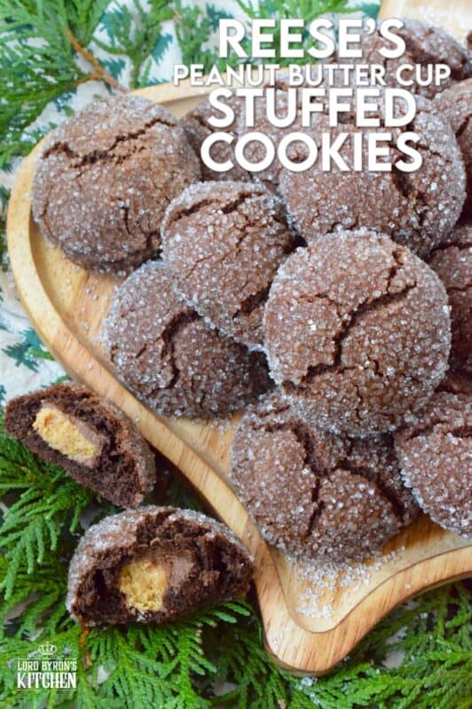 These cookies were prepared with the ultimate chocolate and peanut butter lover in mind. Reese's Peanut Butter Cup Stuffed Cookies are prepared with a rich chocolaty and fudgy base, which is wrapped around a single miniature peanut butter cup candy. These are perfect for Christmastime when calories don't count! #reeses #peanutbuttercups #stuffed #cookies