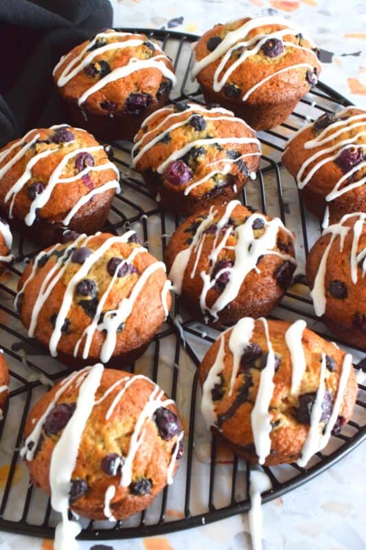 Muffins are one of those things that never seem to last very long in our home. If that muffin has a banana base and is packed with berries, all the more better! Blueberry Banana Muffins are the perfect grab and go breakfast item! #banana #blueberry #muffins