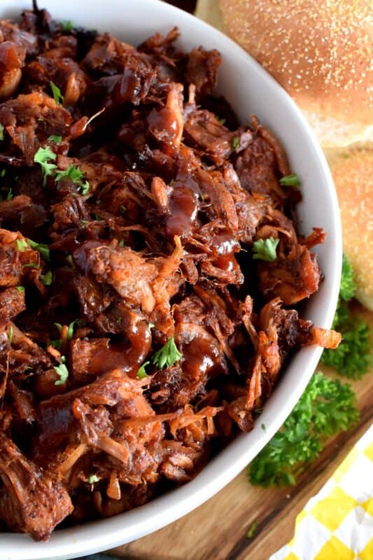 Pulled Pork can now be enjoyed by everyone! Vegetarian Pulled Pork is about as close to the real thing as you're ever going to get! Look at those fibers; doesn't it look like real meat? Unlike real pulled pork, this vegetarian version is much cheaper and takes only 40 minutes from start to finish! #pork #jackfruit #vegetarian #pulledpork