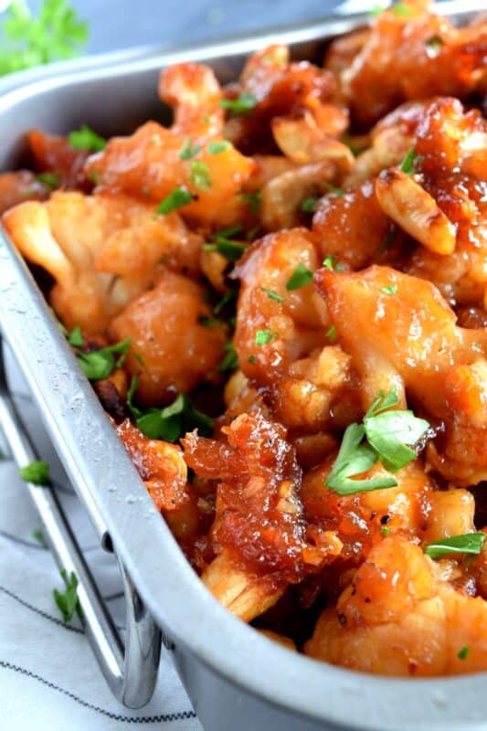 Cashew Cauliflower is the vegetarian equivalent of the classic Chinese buffet favourite, Cashew Chicken. The same great flavour as your favourite Chinese take out, but in vegetarian format. This is one of those recipes that you will want to make over and over again. Yum! #cashew #cauliflower #takeout #vegetarian #asian