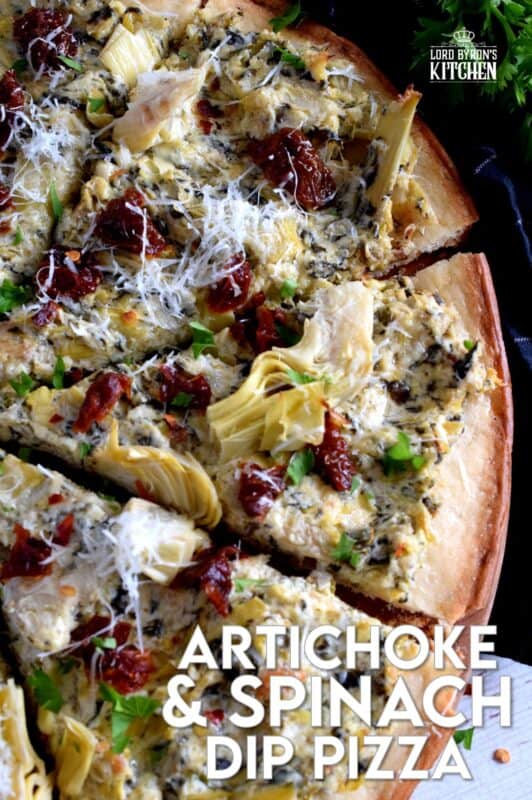 Artichoke and Spinach Dip is an extremely popular appetizer served at many family-style restaurants. But, why not make that delicious dip into a meal with an easy-to-make Artichoke and Spinach Dip Pizza!? Top with sun dried tomatoes and fresh parmesan for even more flavour! #artichokes #spinach #pizza #dip #sundried #tomatoes