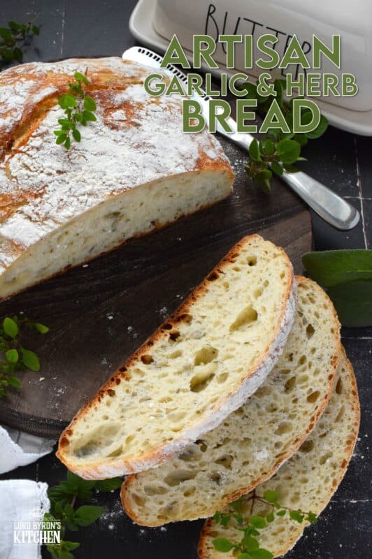 Freshly baked homemade bread is the ultimate comfort food.  There really is nothing like it!  Artisan Garlic and Herb Bread is one of the most delicious and easiest breads you’ll ever make! Loaded with fresh chopped garlic and herbs, this bread is quite aromatic and very savoury! #bread #noknead #dutchoven #homemade #garlic #herbs