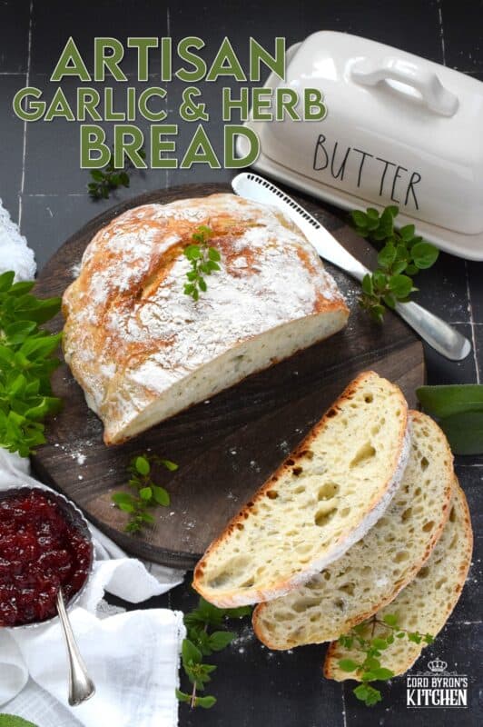Freshly baked homemade bread is the ultimate comfort food.  There really is nothing like it!  Artisan Garlic and Herb Bread is one of the most delicious and easiest breads you’ll ever make! Loaded with fresh chopped garlic and herbs, this bread is quite aromatic and very savoury! #bread #noknead #dutchoven #homemade #garlic #herbs