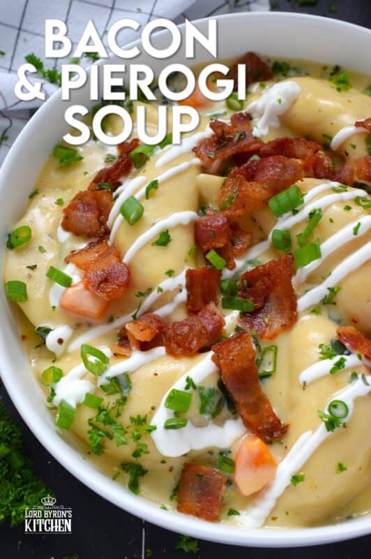 Bacon and Pierogi Soup starts with crispy, fried bacon being tossed with fragrant rosemary. Next, aromatic vegetables like carrots, onions, and celery are added to the pot with garlic and thyme. Frozen pierogies are added and cooked in a thick soup with shredded cheese. Ladle up a big bowl and top it with that rosemary-infused bacon, sour cream, and more cheese. #soup #pierogi #bacon