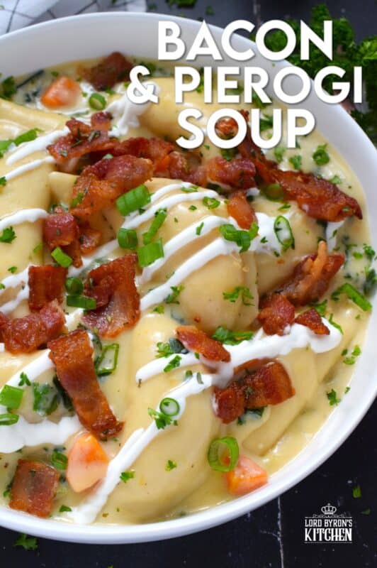 Bacon and Pierogi Soup starts with crispy, fried bacon being tossed with fragrant rosemary. Next, aromatic vegetables like carrots, onions, and celery are added to the pot with garlic and thyme. Frozen pierogies are added and cooked in a thick soup with shredded cheese. Ladle up a big bowl and top it with that rosemary-infused bacon, sour cream, and more cheese. #soup #pierogi #bacon