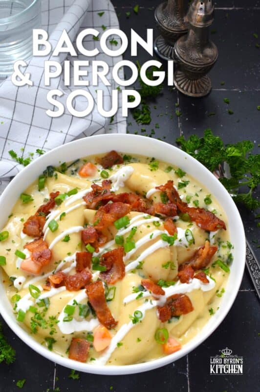 Bacon and Pierogi Soup starts with crispy, fried bacon being tossed with fragrant rosemary. Next, aromatic vegetables like carrots, onions, and celery are added to the pot with garlic and thyme. Frozen pierogies are added and cooked in a thick soup with shredded cheese. Ladle up a big bowl and top it with that rosemary-infused bacon, sour cream, and more cheese. #soup #pierogi #bacon