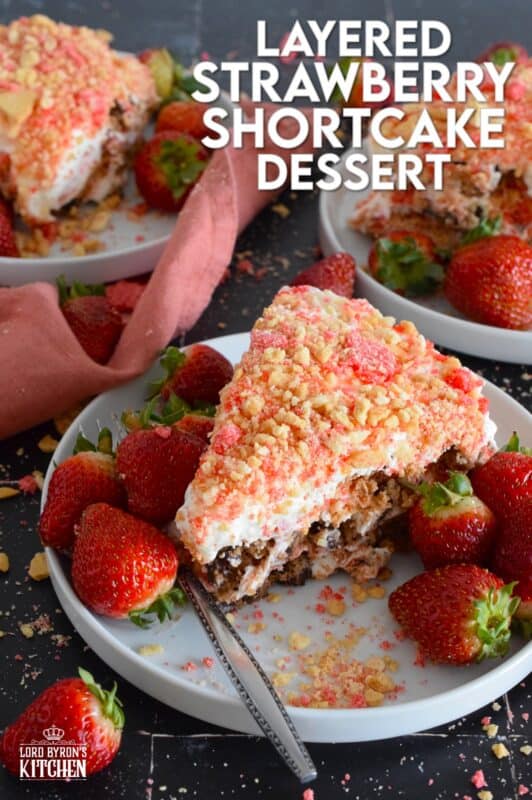 A no-bake dessert that is best prepared in advance and refrigerated overnight, this delicious Layered Strawberry Shortcake Dessert uses homemade strawberry shortcake crumbs, chocolate chip cookies, and a cream cheese-based cream topping. Serve with fresh strawberries! #strawberry #shortcake #dessert #layered #cookies #creamcheese