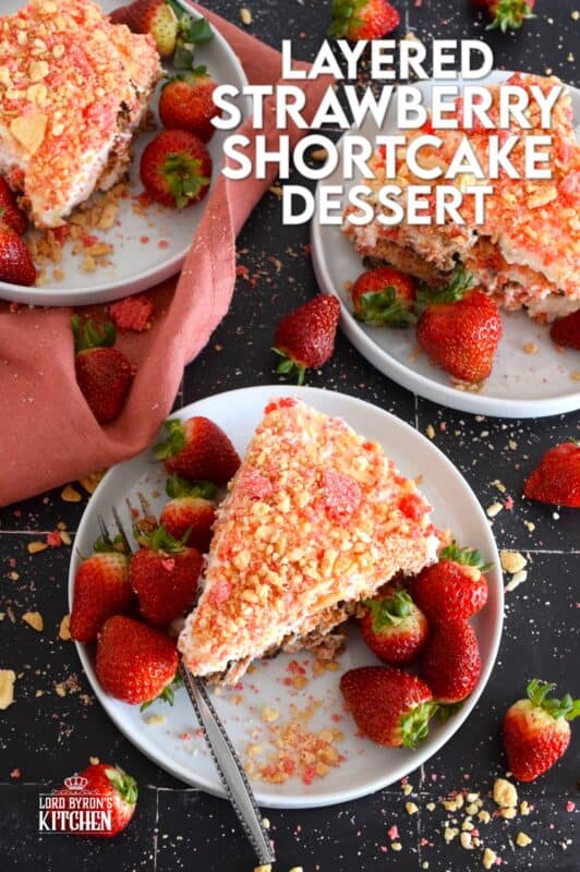 A no-bake dessert that is best prepared in advance and refrigerated overnight, this delicious Layered Strawberry Shortcake Dessert uses homemade strawberry shortcake crumbs, chocolate chip cookies, and a cream cheese-based cream topping. Serve with fresh strawberries! #strawberry #shortcake #dessert #layered #cookies #creamcheese