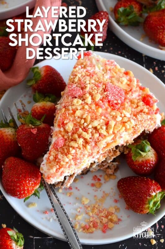 A no-bake dessert that is best prepared in advance and refrigerated overnight, this delicious Layered Strawberry Shortcake Dessert uses homemade strawberry shortcake crumbs, chocolate chip cookies, and a cream cheese-based cream topping. Serve with fresh strawberries! #strawberry #shortcake #dessert #layered #cookies #creamcheese