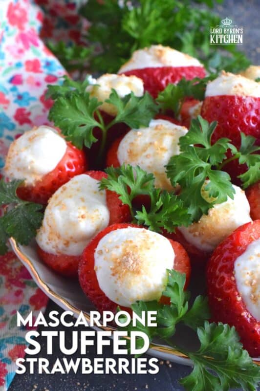 Mascarpone is blended with cream, sugar, and vanilla to make the most delicious dessert topping. In this recipe, the mixture is stuffed into hulled fresh strawberries and topped with a sprinkling of graham cracker crumbs for texture and flavour. This simple and easy dessert is big on taste! #mascarpone #stuffed #strawberries #nobake #dessert