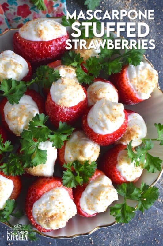 Mascarpone is blended with cream, sugar, and vanilla to make the most delicious dessert topping. In this recipe, the mixture is stuffed into hulled fresh strawberries and topped with a sprinkling of graham cracker crumbs for texture and flavour. This simple and easy dessert is big on taste! #mascarpone #stuffed #strawberries #nobake #dessert
