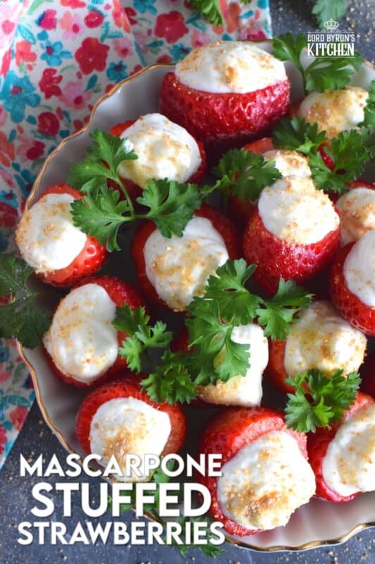 Mascarpone is blended with cream, sugar, and vanilla to make the most delicious dessert topping. In this recipe, the mixture is stuffed into hulled fresh strawberries and topped with a sprinkling of graham cracker crumbs for texture and flavour. This simple and easy dessert is big on taste! #mascarpone #stuffed #strawberries #nobake #dessert