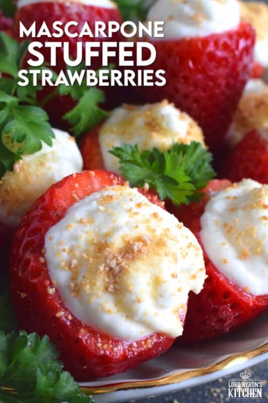 Mascarpone is blended with cream, sugar, and vanilla to make the most delicious dessert topping. In this recipe, the mixture is stuffed into hulled fresh strawberries and topped with a sprinkling of graham cracker crumbs for texture and flavour. This simple and easy dessert is big on taste! #mascarpone #stuffed #strawberries #nobake #dessert