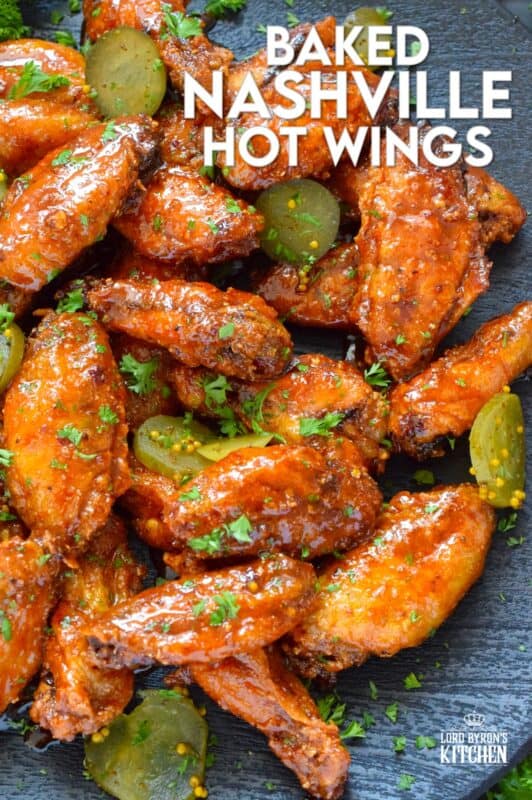 Baked to perfection with a crispy coating and a tender and juicy interior, these wings are drenched in a hot sauce comprised of cayenne, chili, garlic, onion, and melted butter, Baked Nashville Hot Wings also have an optionally sweet honey component! Plate these wings with sweet pickle slices for a cooling crunch! #baked #nashville #hot #chicken #wings #sticky
