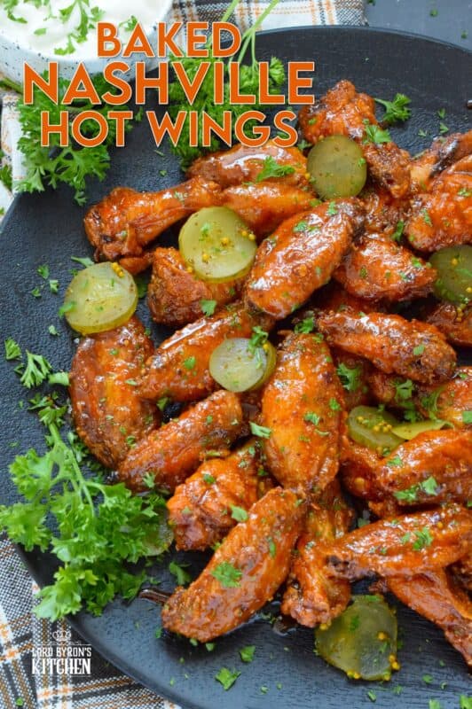 Baked to perfection with a crispy coating and a tender and juicy interior, these wings are drenched in a hot sauce comprised of cayenne, chili, garlic, onion, and melted butter, Baked Nashville Hot Wings also have an optionally sweet honey component! Plate these wings with sweet pickle slices for a cooling crunch! #baked #nashville #hot #chicken #wings #sticky