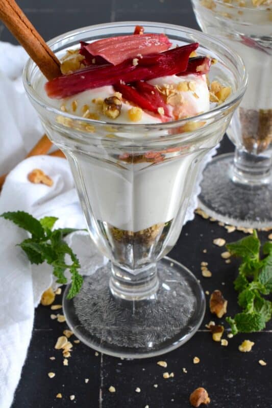 Roasted Rhubarb Parfait is a beautifully presented dessert with exceptional flavour! Easy to prepare, roasted rhubarb is layered with toasted cinnamon walnuts and oats, and vanilla bean yogurt. This simple refreshing summertime dessert is a healthy alternative with just enough guilty indulgence! #rhubarb #parfait #desserts