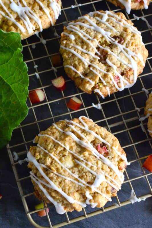 Rhubarb White Chocolate Oatmeal Cookies are both sweet and tart and completely indulgent too! The flavour combination is created by pairing tart rhubarb with oats, sugar, white chocolate chips, and vanilla pudding mix! These cookies are massively large, soft, chewy, and delicious! #rhubarb #oatmeal #cookies #jumbo