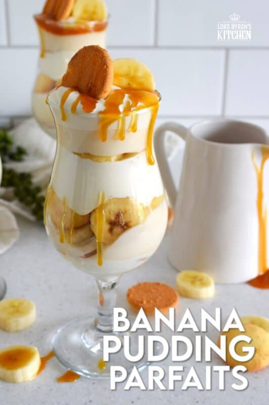 Layers of vanilla wafer cookies, homemade mascarpone cream, banana pudding, and freshly sliced bananas, these parfaits are quick and easy to make! Serve them family style or fancy them up by serving them in these individual glasses. Top with whipped cream and an optional caramel drizzle. They're a feast for the eyes! #banana #pudding #parfait #nobake #layered #dessert