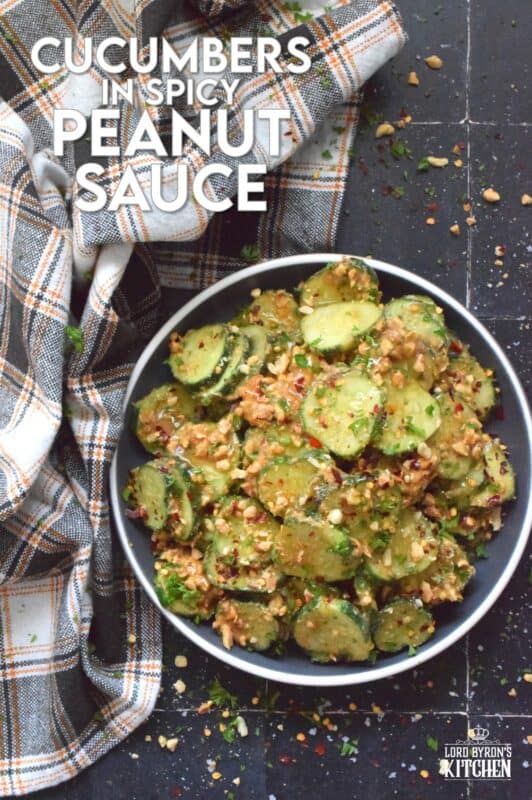Fresh cucumbers are sliced and tossed in a quick and easy homemade nutty, salty, creamy, spicy, and garlicky sauce.  Toasting the peanuts first and combining them with peanut butter, soy sauce, and rice vinegar makes a delicious cold side, salad, or snack.  Serve at room temperature immediately after preparing for the best results! #cucumber #peanut #peanutbutter #peanutsauce #salad #spicy